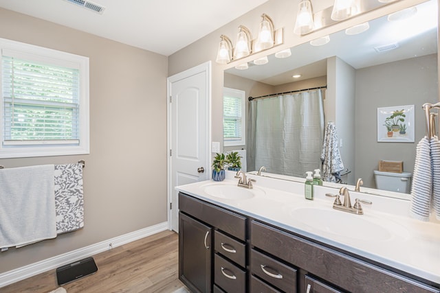 2905 N N Garth Ave, Columbia, MO 65202 - full bath featuring wood finished floors, double vanity, and curtained shower