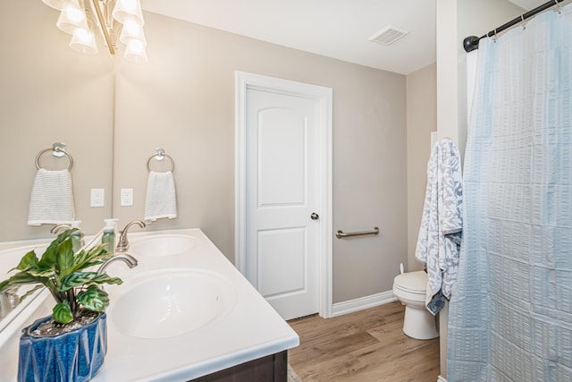 2905 N N Garth Ave, Columbia, MO 65202 - full bathroom featuring double vanity, wood finished floors, and a chandelier