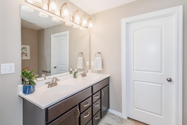 2905 N N Garth Ave, Columbia, MO 65202 - bathroom featuring double vanity and baseboards