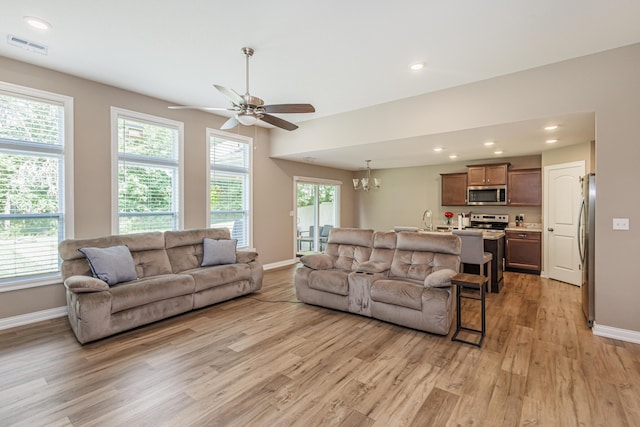 2905 N N Garth Ave, Columbia, MO 65202 - living area with light wood-style flooring, a ceiling fan, a chandelier, and recessed lighting