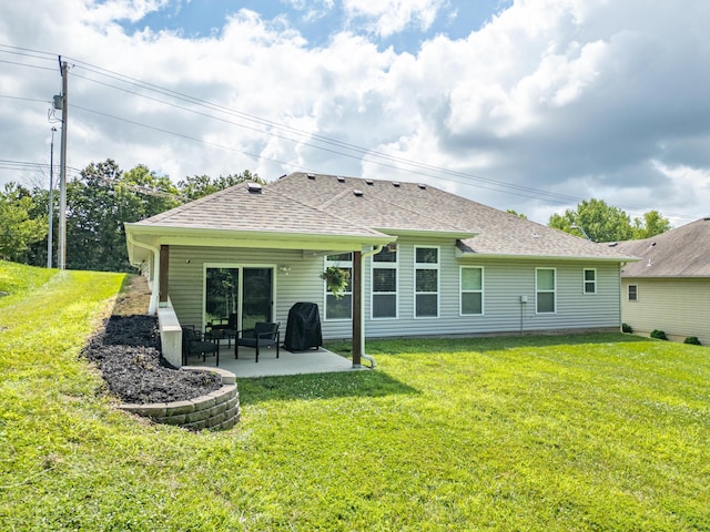 2905 N N Garth Ave, Columbia, MO 65202 - back of property featuring a patio, roof with shingles, and a yard