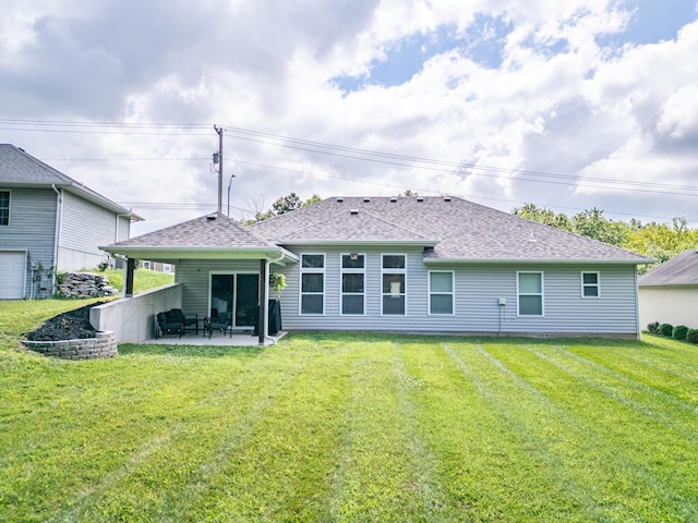 2905 N N Garth Ave, Columbia, MO 65202 - rear view of house featuring a patio area, a yard, and a shingled roof