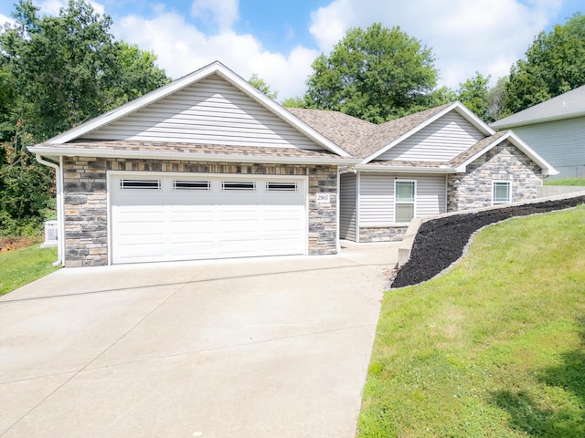 2905 N N Garth Ave, Columbia, MO 65202 - view of front of house featuring stone siding, a garage, concrete driveway, a front yard, and a shingled roof