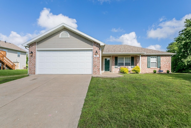 1703 Osage Dr, Columbia, MO 65202 - ranch-style home featuring driveway, brick siding, an attached garage, and a front yard