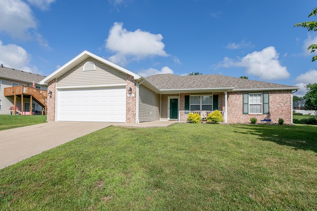 1703 Osage Dr, Columbia, MO 65202 - ranch-style house with an attached garage, concrete driveway, a front yard, brick siding, and a porch