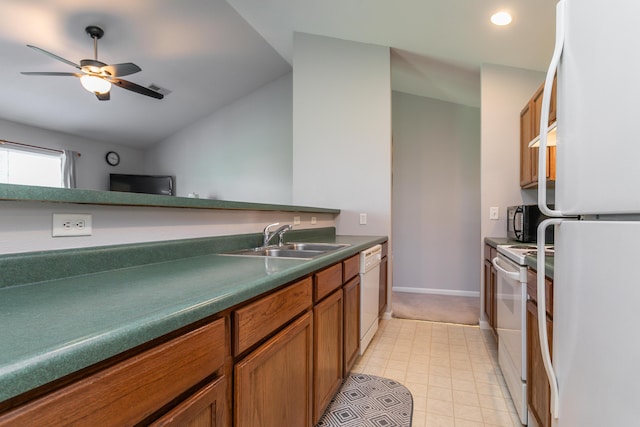 1703 Osage Dr, Columbia, MO 65202 - kitchen with white appliances, brown cabinets, lofted ceiling, dark countertops, and a ceiling fan
