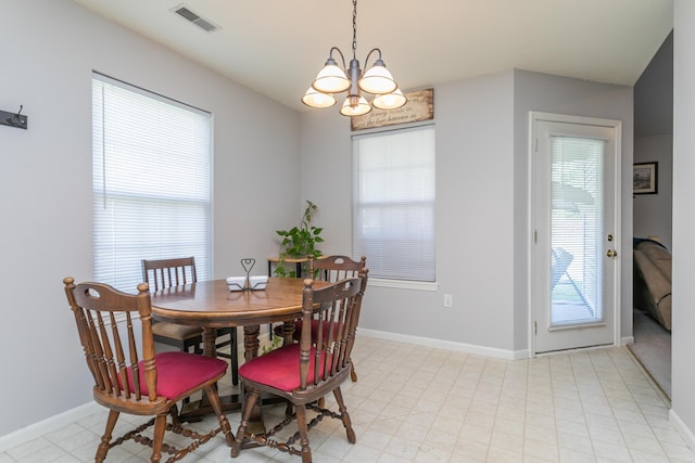 1703 Osage Dr, Columbia, MO 65202 - dining space with baseboards and a chandelier