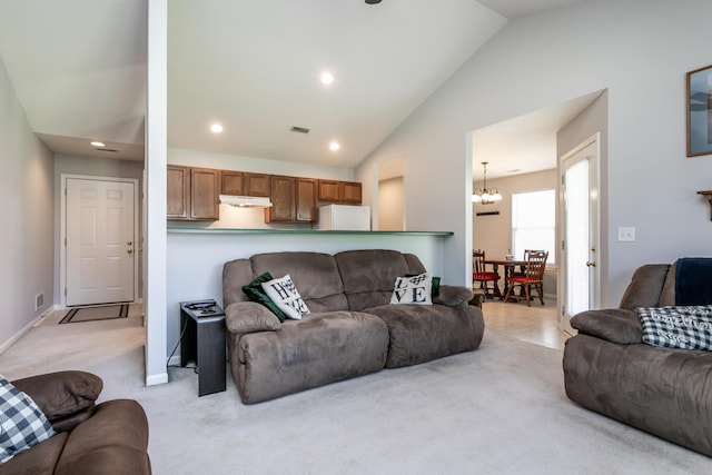 1703 Osage Dr, Columbia, MO 65202 - living room with lofted ceiling, light carpet, a chandelier, and recessed lighting