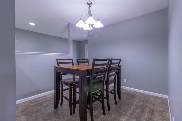 7700 N Ballew Rd, Hallsville, MO 65255 - dining space featuring a chandelier and baseboards