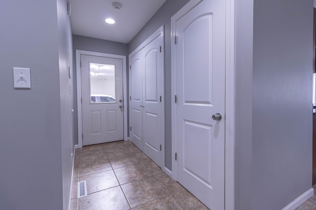 7700 N Ballew Rd, Hallsville, MO 65255 - entryway featuring baseboards and light tile patterned flooring