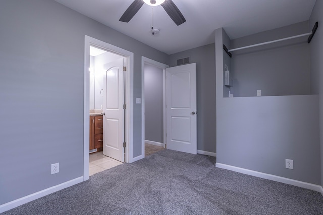 7700 N Ballew Rd, Hallsville, MO 65255 - unfurnished bedroom featuring light colored carpet, ensuite bathroom, and a ceiling fan