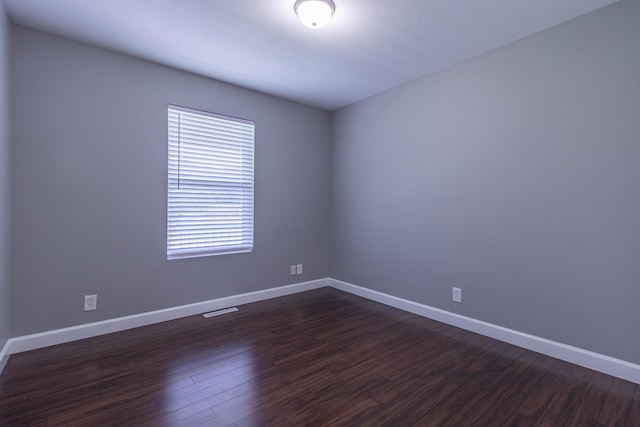 7700 N Ballew Rd, Hallsville, MO 65255 - spare room with dark wood finished floors and baseboards