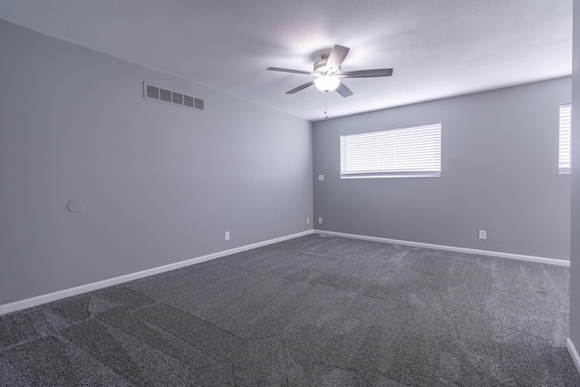 7700 N Ballew Rd, Hallsville, MO 65255 - unfurnished room with a ceiling fan and dark colored carpet