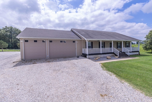 7700 N Ballew Rd, Hallsville, MO 65255 - view of front of house featuring a porch, driveway, a garage, a front lawn, and roof with shingles