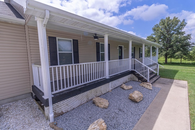 7700 N Ballew Rd, Hallsville, MO 65255 - covered porch featuring ceiling fan and a lawn