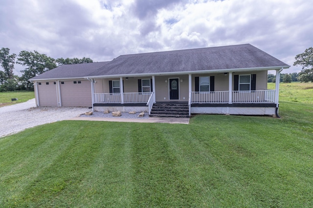 7700 N Ballew Rd, Hallsville, MO 65255 - ranch-style home with covered porch, driveway, an attached garage, and a front lawn