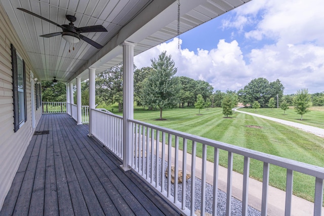 7700 N Ballew Rd, Hallsville, MO 65255 - porch with a ceiling fan, a yard, and view of scattered trees