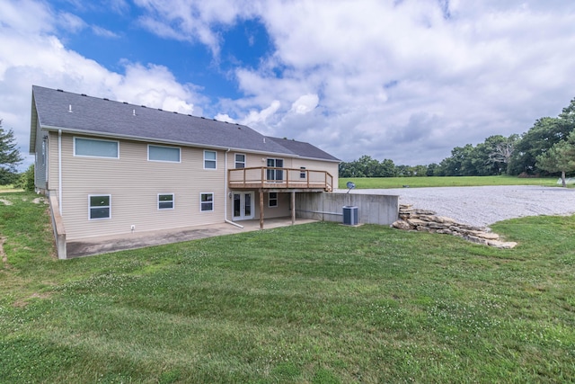7700 N Ballew Rd, Hallsville, MO 65255 - rear view of property with a patio, a lawn, and a deck