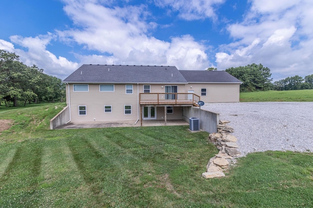 7700 N Ballew Rd, Hallsville, MO 65255 - rear view of house featuring a patio, a wooden deck, and a yard