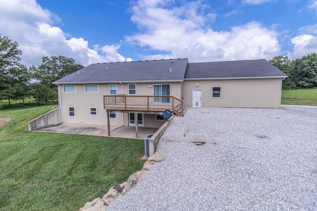7700 N Ballew Rd, Hallsville, MO 65255 - rear view of property with a patio, a wooden deck, a lawn, and roof with shingles