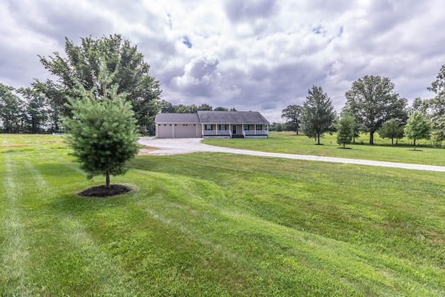 7700 N Ballew Rd, Hallsville, MO 65255 - view of front of property with driveway, a front yard, and a garage