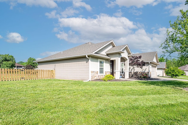 3405 Piranha Ct, Columbia, MO 65202 - view of front facade featuring stone siding, stucco siding, a garage, driveway, and roof with shingles
