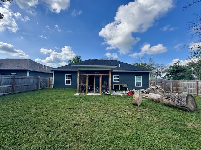 200 W Lakeview Ave, Centralia, MO 65240 - back of house with a sunroom, a fenced backyard, and a shingled roof