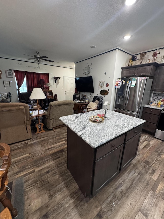 200 W Lakeview Ave, Centralia, MO 65240 - kitchen featuring stainless steel refrigerator with ice dispenser, open floor plan, dark wood finished floors, a ceiling fan, and crown molding