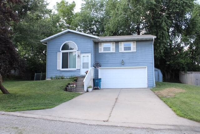 511 Turner Ave, Ashland, MO 65010 - view of front of property with a front yard, an attached garage, and driveway