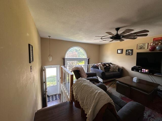 511 Turner Ave, Ashland, MO 65010 - living area featuring ceiling fan, a textured ceiling, and wood finished floors