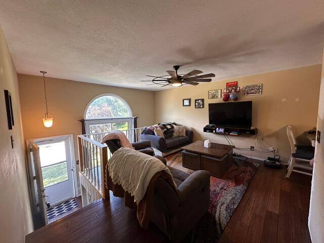 511 Turner Ave, Ashland, MO 65010 - living area featuring hardwood / wood-style floors, a ceiling fan, and a textured ceiling