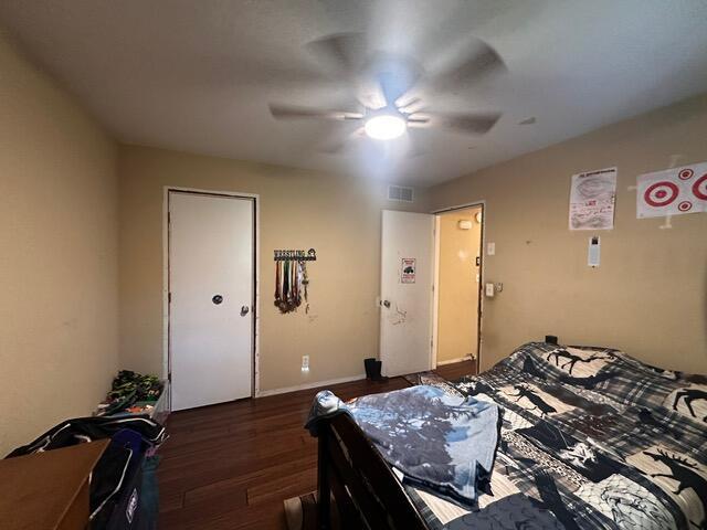 511 Turner Ave, Ashland, MO 65010 - bedroom with dark wood-type flooring and a ceiling fan
