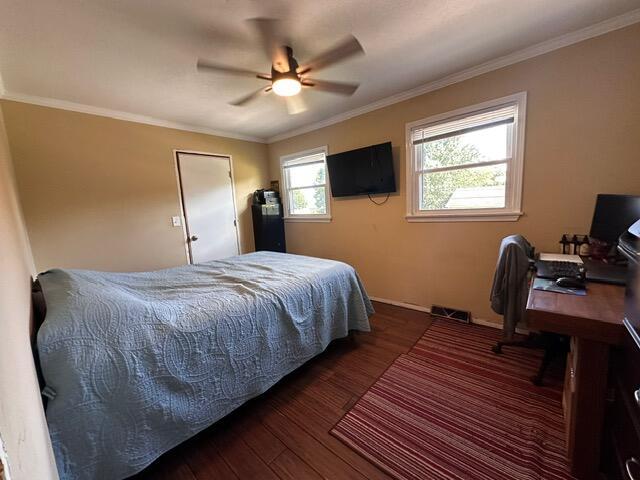 511 Turner Ave, Ashland, MO 65010 - bedroom with wood finished floors, ornamental molding, a ceiling fan, and a desk