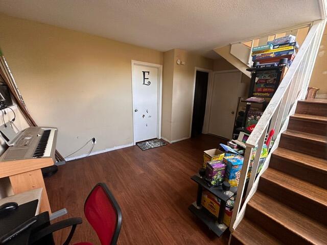511 Turner Ave, Ashland, MO 65010 - staircase with wood finished floors and baseboards
