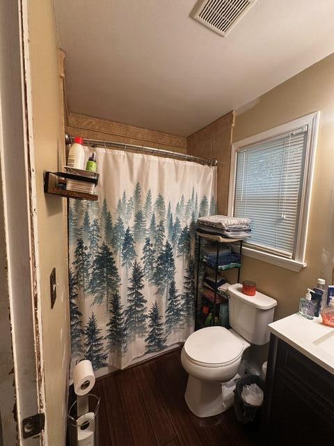 511 Turner Ave, Ashland, MO 65010 - full bathroom with wood finished floors, vanity, and a shower with curtain