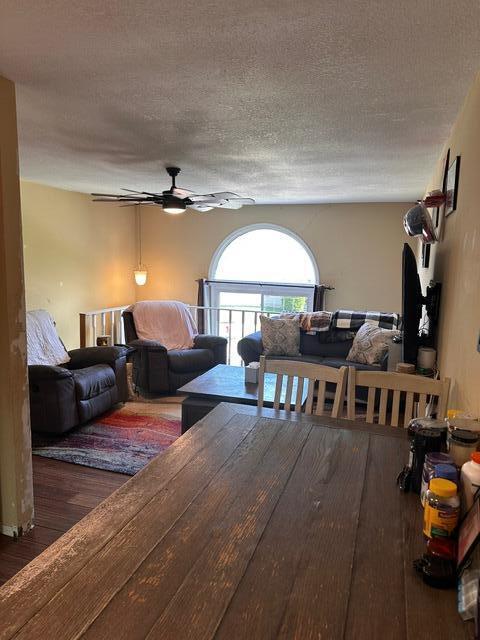 511 Turner Ave, Ashland, MO 65010 - living area featuring a ceiling fan, wood finished floors, and a textured ceiling