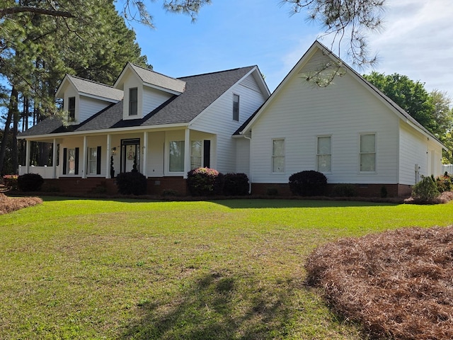 view of front of property with crawl space, a shingled roof, a front lawn, and a porch