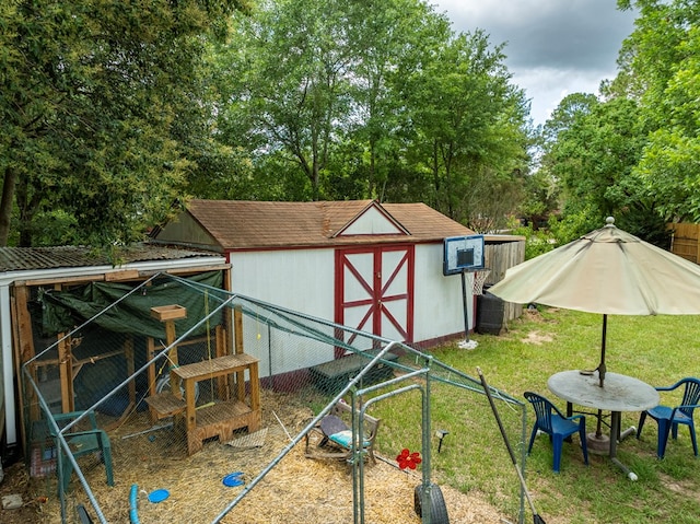 2222 Davis Ave, Tifton, GA 31794 - view of shed featuring exterior structure and view of wooded area