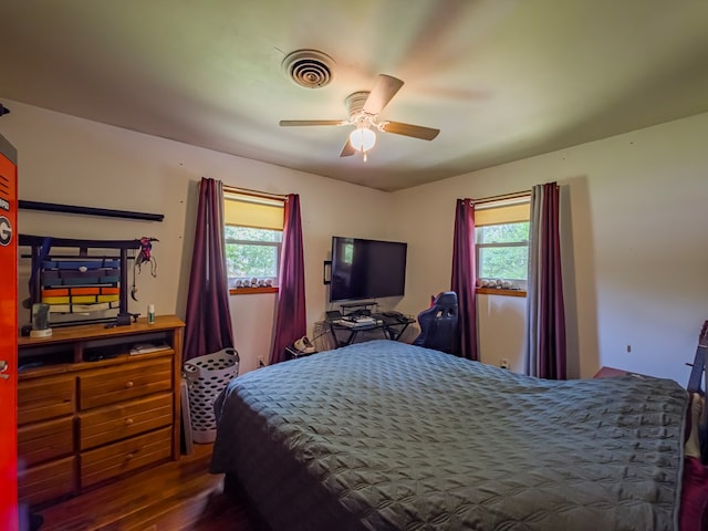 2222 Davis Ave, Tifton, GA 31794 - bedroom featuring multiple windows, wood finished floors, and a ceiling fan
