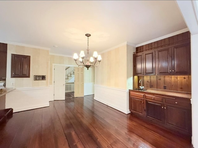 302 W 26th St, Tifton, GA 31794 - unfurnished dining area with stairs, a chandelier, dark wood-type flooring, wainscoting, and crown molding