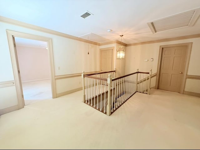 302 W 26th St, Tifton, GA 31794 - hallway with an upstairs landing, carpet flooring, attic access, and crown molding