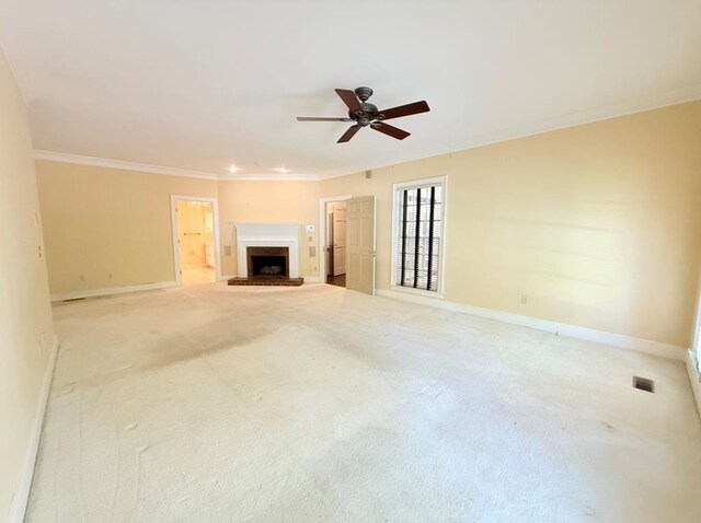 302 W 26th St, Tifton, GA 31794 - unfurnished living room featuring a ceiling fan, light carpet, a fireplace, and ornamental molding