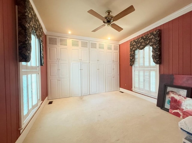 302 W 26th St, Tifton, GA 31794 - unfurnished bedroom featuring ornamental molding, light colored carpet, a ceiling fan, and a closet