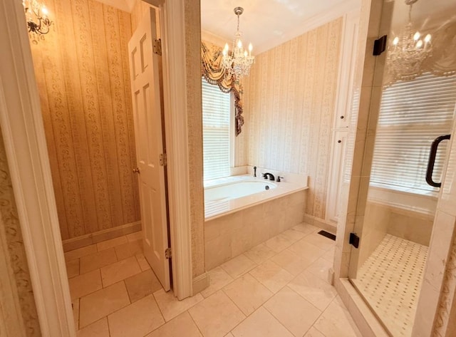 302 W 26th St, Tifton, GA 31794 - full bathroom featuring a chandelier, a bath, a stall shower, wallpapered walls, and tile patterned flooring