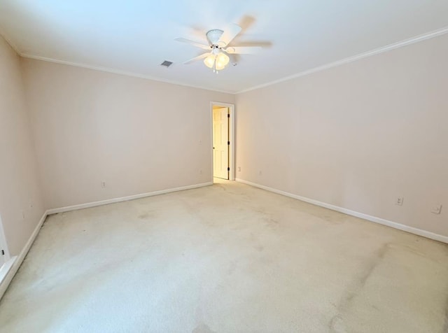 302 W 26th St, Tifton, GA 31794 - spare room featuring a ceiling fan, crown molding, and light colored carpet