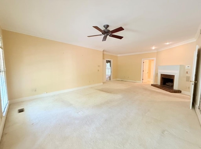 302 W 26th St, Tifton, GA 31794 - unfurnished living room with crown molding, a ceiling fan, a fireplace, and light colored carpet