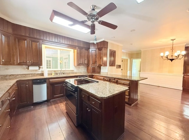 302 W 26th St, Tifton, GA 31794 - kitchen with range with electric stovetop, dark wood-style flooring, a peninsula, a center island, and crown molding