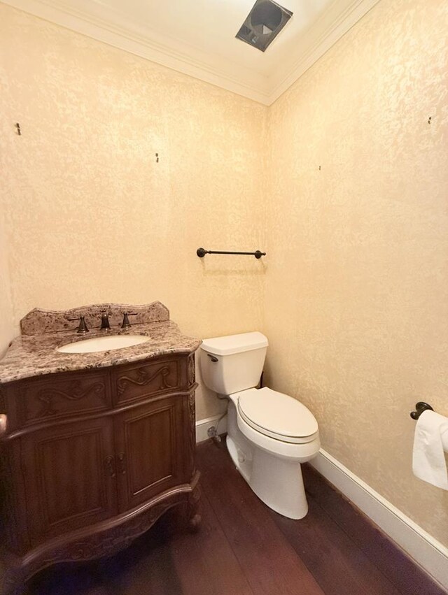 302 W 26th St, Tifton, GA 31794 - bathroom with wood finished floors, vanity, and crown molding