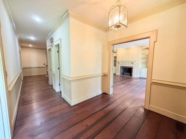 302 W 26th St, Tifton, GA 31794 - hall with ornamental molding, a chandelier, dark wood-type flooring, and recessed lighting