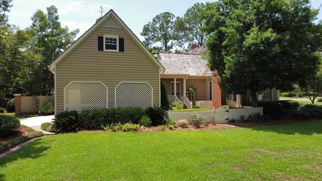 302 W 26th St, Tifton, GA 31794 - view of front of property with a garage, driveway, a chimney, and a porch